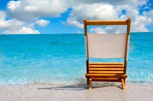 Single chair at the beach photo