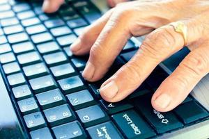 Old hands on keyboard photo