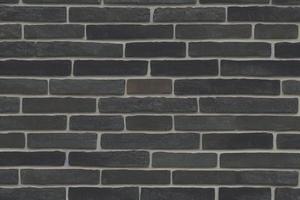 Grey brick wall texture background. Tiled. photo
