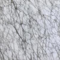 textura de piedra de mármol blanco para el fondo o lujosos suelos de baldosas y diseño decorativo de papel pintado. foto