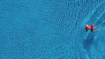 Topview from a drone over the surface of the pool video