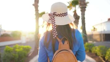 Photographer tourist woman taking photos with camera in a beautiful tropical landscape at sunset video