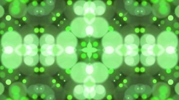 Green kaleidoscope bokeh shiny particle rain motion light luminance illustration night background, artistic space bokeh speed matrix magic effect background animation. video