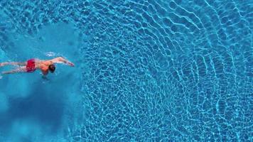 Topview from a drone over the surface of the pool video