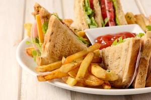 French fries and club sandwich photo