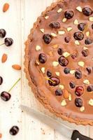 Chocolate tart with cherries photo