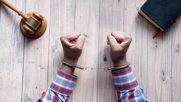 Hands of a man with handcuffs close up video