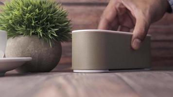 Smart speaker and keyboard with copy space on wooden background video