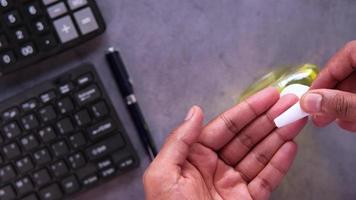 mans hands using hand sanitizer gel, close up video