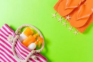 Summer bag background with copy space. Flat lay photo on color table, travel concept. Free space for text, mock-up