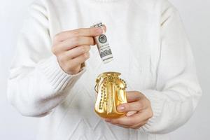 Close-up Of A Woman Holding Gift Box Of Dollar photo