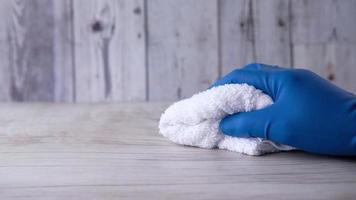 Hand holding spray bottle and cleaning table video