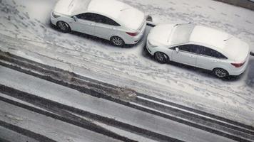 Row of cars covered in snow video