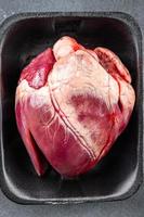 heart raw meat offal pork or beef meal food snack on the table copy space food background rustic top view photo