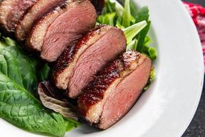 duck breast roasted meat poultry meal food snack on the table copy space food background rustic top view photo