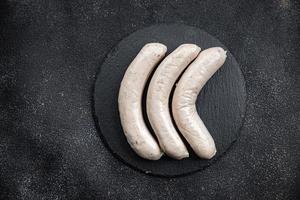 White sausage weisswurst veal, pork, lard, spices natural casing meal food snack on the table copy space food background rustic top view photo