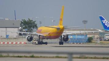 FRANKFURT AM MAIN, GERMANY JULY 19, 2017 - DHL Airbus 310 D AEAN towing by tractor before departure. Fraport, Frankfurt, Germany video