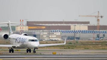 FRANKFURT AM MAIN, GERMANY JULY 19, 2017 - Adria Airways Bombardier CRJ 701ER S5 AAY turn to start before departure at runway 18. Fraport, Frankfurt, Germany video