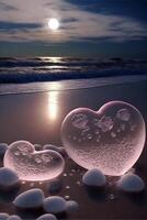 couple of glass hearts sitting on top of a sandy beach. . photo