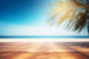 Blurred background, wooden table with a palm tree on the background of the sea. Copy space. photo