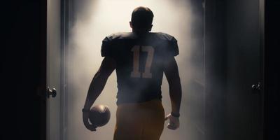 football player walks into a dark room photo