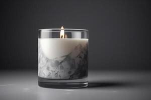 White Pillar Candle In A Glass Jar On Gray Background Mockup photo