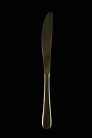 Gold knife on a black background. Cutlery. photo