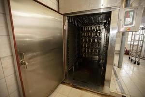 Industrial smoking of fish. Mackerel in a smoking oven. photo