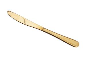 Gold knife on a white background. Cutlery. photo