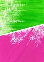 Acrylic or gouache bright green and pink paint on texture paper. Two abstract drawings lie on on surface, overlapping each other. Partially visible, close up, vertical image. photo