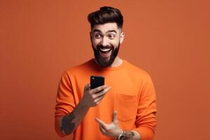A man with a surprised expression is holding a phone in his hands. photo
