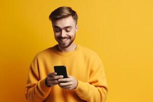 A man with a surprised expression is holding a phone in his hands. photo