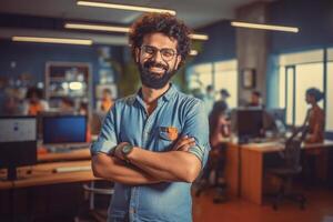 Portrait of smiling businessman standing with arms crossed in creative office. photo