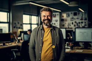 Portrait of smiling businessman standing with arms crossed in creative office. photo