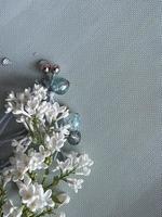 White Lilac flowers with beads photo