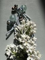 White Lilac flowers with beads photo