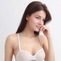 smiling girl in white bra on white background photo