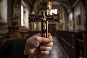 Church priest holds religious cross in hands. photo