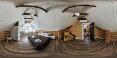 360 hdri panorama in interior of wooden eco bedroom in rustic style homestead on mansard floor with rafter ceiling in equirectangular projection with zenith and nadir. VR AR content photo