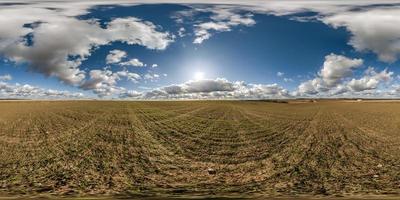 spherical 360 hdri panorama among farming field with clouds on blue sky in equirectangular seamless projection, use as sky replacement in drone panoramas, game development as sky dome or VR content photo