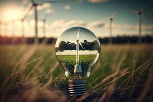 Green energy concept. Electric lightbulb and wind turbines in field. photo