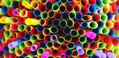 Close up pattern of colorful straw or tube sorting for background with selective focus at Center photo. Art wallpaper and Texture of object. photo