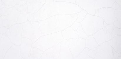 White cement wall crack for background. Art wallpaper, Abstract and Surface of material concept photo