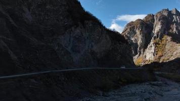 Aerial View of Bus Driving on Mountain Road video