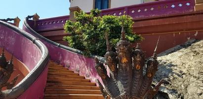 Red stairway to the temple with a six head of serpent decorated on handrail of the stair. The Naga sacred animals according to Buddhist. Design and Exterior photo