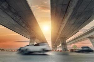 Construction of asphalt highways and overpasses in Asia, view of road junction against the sky photo