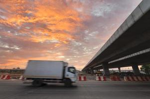 Construction of asphalt highways and overpasses in Asia, view of road junction against the sky photo