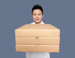 Man holding and giving cardboard box in front view photo