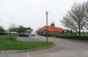 Beautiful Low Angle View of Caldecotte Lake Park and Pub with Restaurant. The Image Was Captured on 09-April-2023 During Cloudy Sunset with Cold Weather and Winds. photo