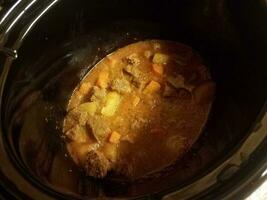 beef olive and potato stew cooking in a hot pot photo